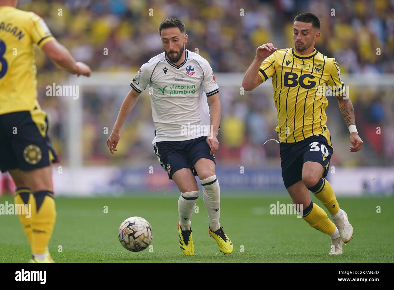 LONDON, ENGLAND - MAY 18: Josh Sheehan of Bolton Wanderers under pressure from Owen Dale of Oxford United during the Sky Bet League One Play-Off Final match between Bolton Wanderers and Oxford United at Wembley Stadium on May 18, 2024 in London, England.(Photo by Dylan Hepworth/MB Media) Stock Photo