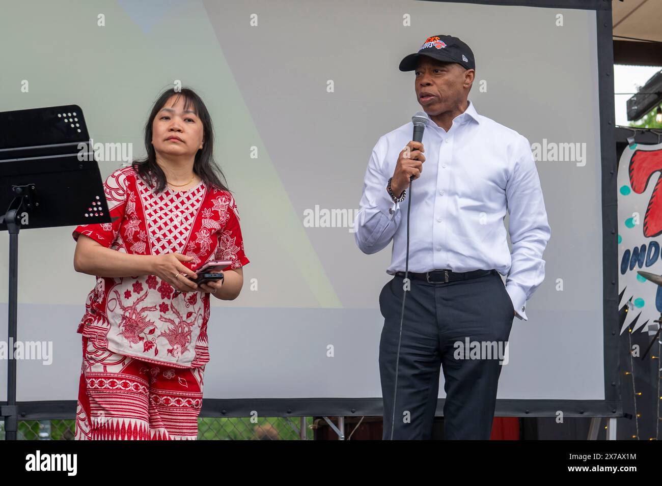 New York City Mayor Eric Adams (R) and Fefe Anggono (L) delivers
