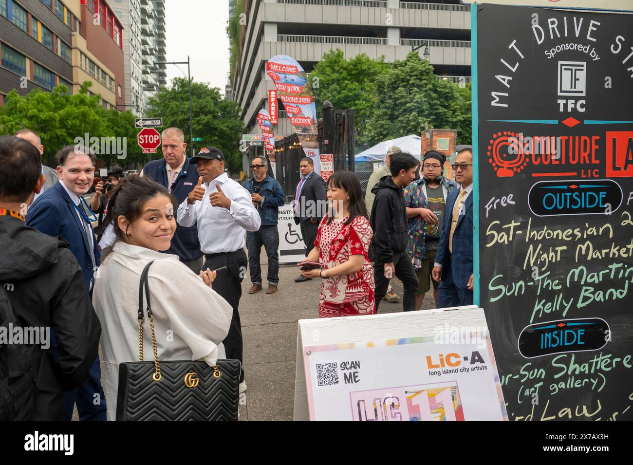 New York City Mayor Eric Adams (C) departs the Indonesian Culinary