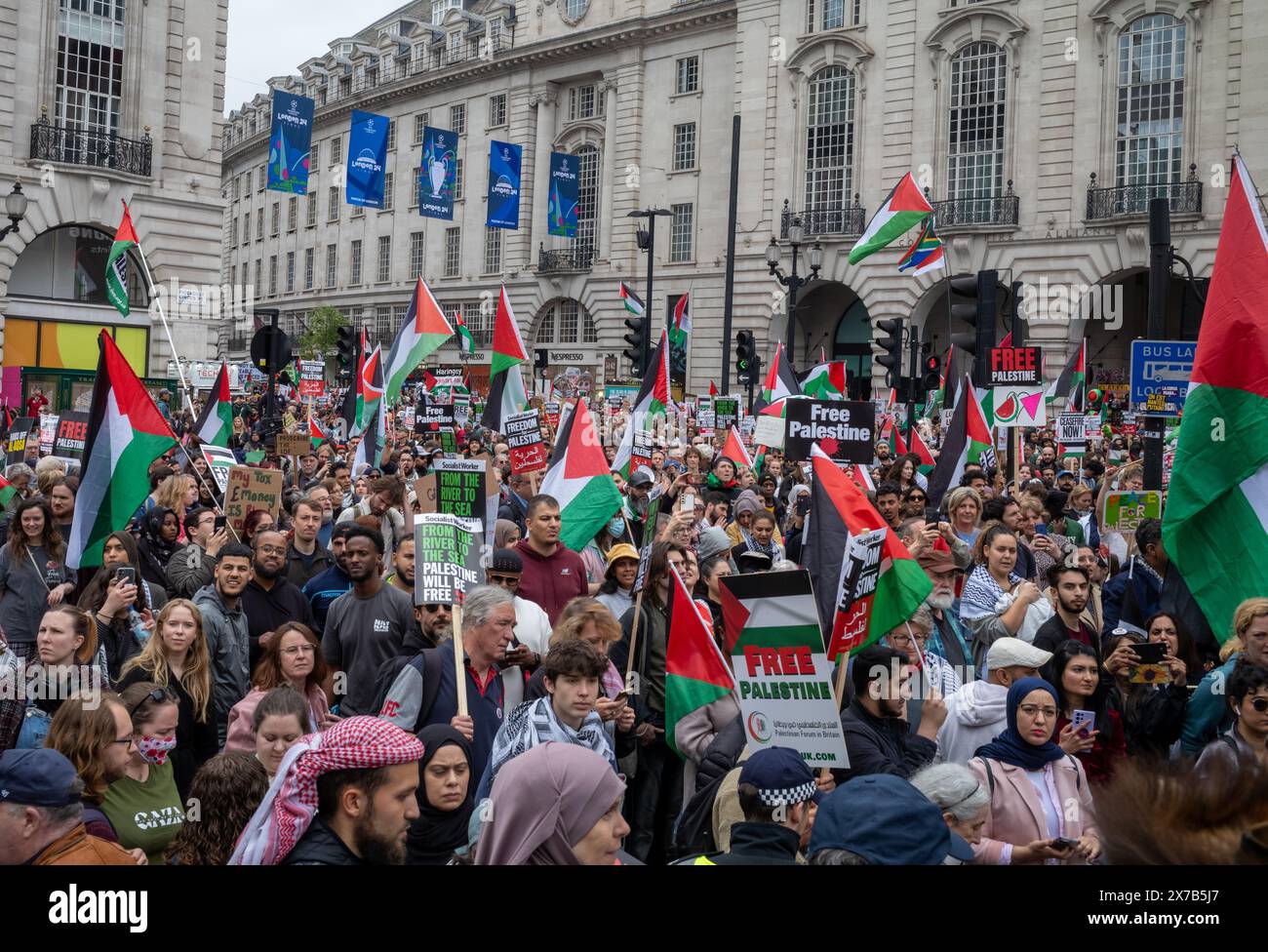 London, UK. 18 May 2024: Demonstrators at Piccadilly Circus at the Nakba 76 March for Palestine against Israeli attacks on Gaza in central London, UK. A huge march marked the 76th anniversary of the 'Palestinian Catastrophe' in 1948 and called for a ceasefire in Gaza. Stock Photo