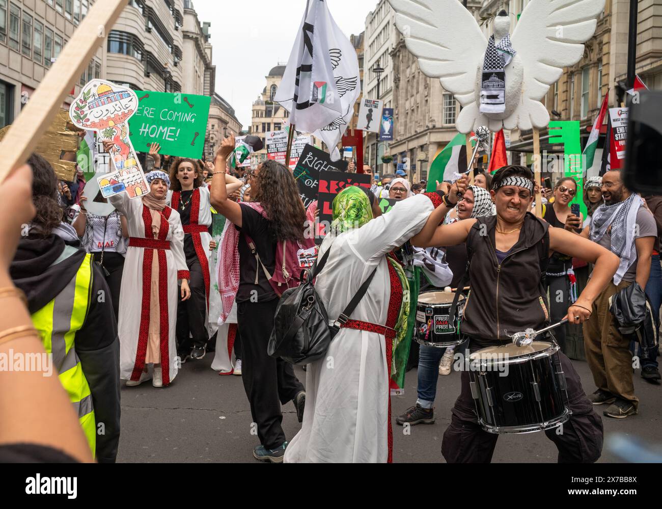 London, UK. 18 May 2024: Demonstrators play drums and chant at the Nakba 76 March for Palestine against Israeli attacks on Gaza in central London, UK. A huge march marked the 76th anniversary of the 'Palestinian Catastrophe' in 1948 and called for a ceasefire in Gaza. Stock Photo