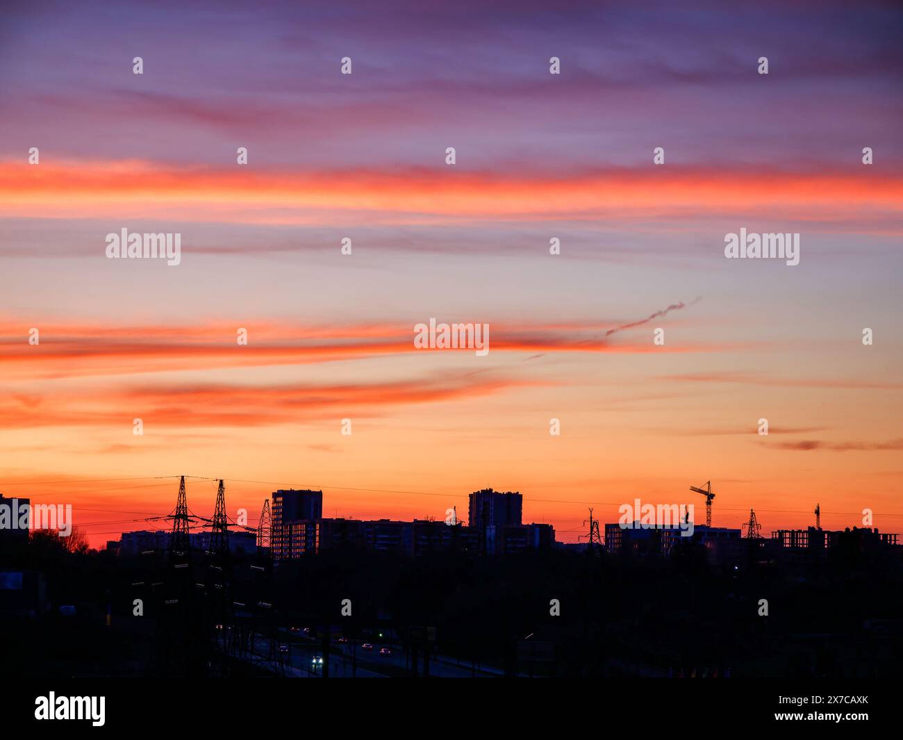 Urban silhouette against vibrant dusk, ideal for travel and calming