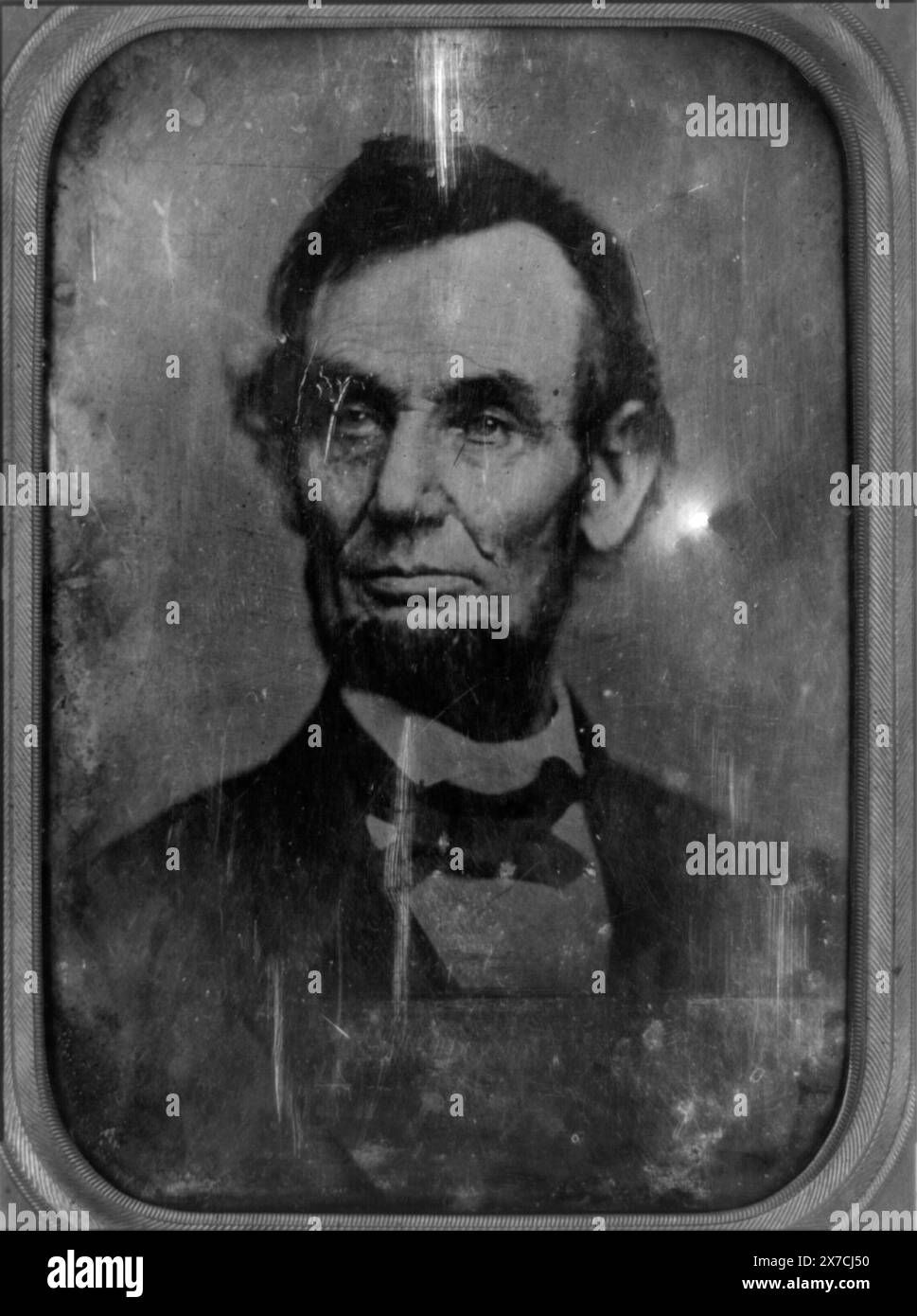 Abraham Lincoln, head-and-shoulders portrait, facing slightly left, Photographer unidentified., Copy daguerreotype of post-1860 albumen photograph; daguerreotype image is reversed (). Cropped version of Meserve no. 87 and 108., Case: plain leather, push button., Was part of LOT 12559., Forms part of: Anson Gonger Goodyear collection of Lincoln Images ,  Gift; Anson Conger Goodyear; 1964., Forms part of: Daguerreotype collection  Lincoln, Abraham,  1809-1865. Stock Photo