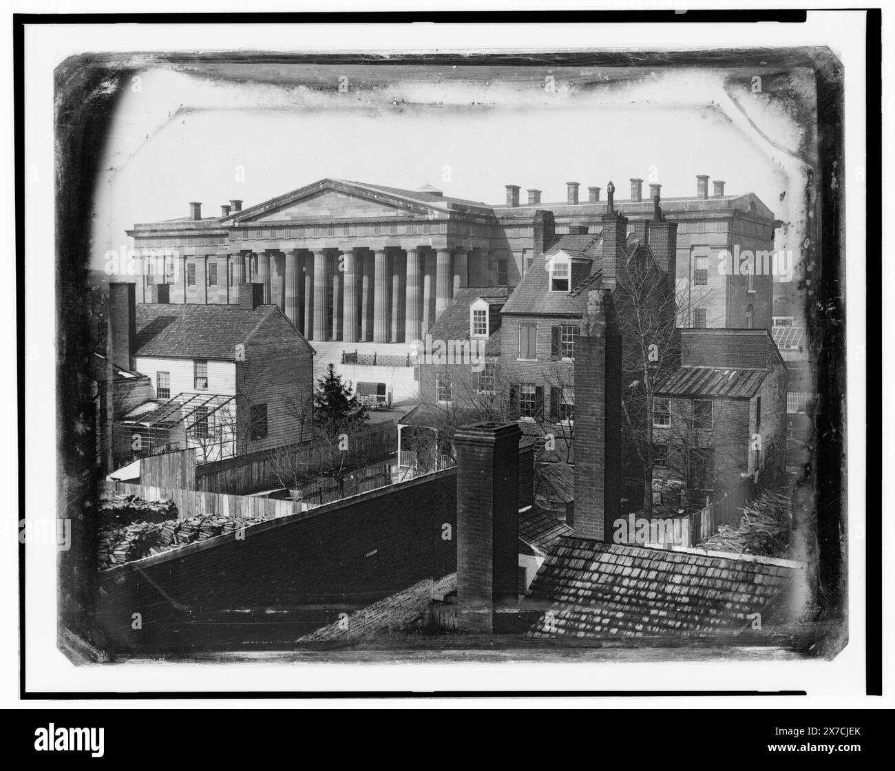 United States Patent Office, Washington, D.C., showing F Street facade, possibly taken from the upper floor of the General Post Office, Caption label from exhibit 'American Treasures Imagination': Early Views of Washington. Several government buildings were among the first edifices in the nation's capital to be recorded by the relatively new medium of photography. John Plumbe, Jr., the first professional photographer in Washington, D.C., operated a studio in the mid-1840s. He recorded the U.S. Patent Office, which now houses the Smithsonian's National Portrait Gallery and National Museum of Am Stock Photo