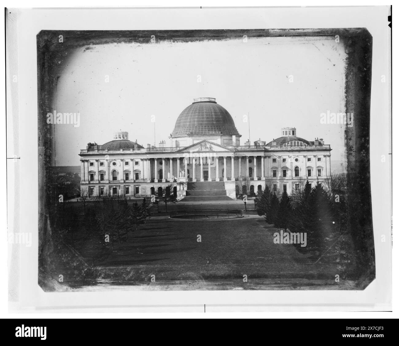 United States Capitol, Washington, D.C., east front elevation, Caption label from exhibit 'American Treasures Imagination': Early Views of Washington. Several government buildings were among the first edifices in the nation's capital to be recorded by the relatively new medium of photography. John Plumbe, Jr., the first professional photographer in Washington, D.C., operated a studio in the mid-1840s. Plumbe's image of the Capitol, with its former copper-sheathed wooden dome, is the earliest surviving photograph of the building., Title devised by Library staff., Purchase; 1972; (DLC/PP-1972:R0 Stock Photo
