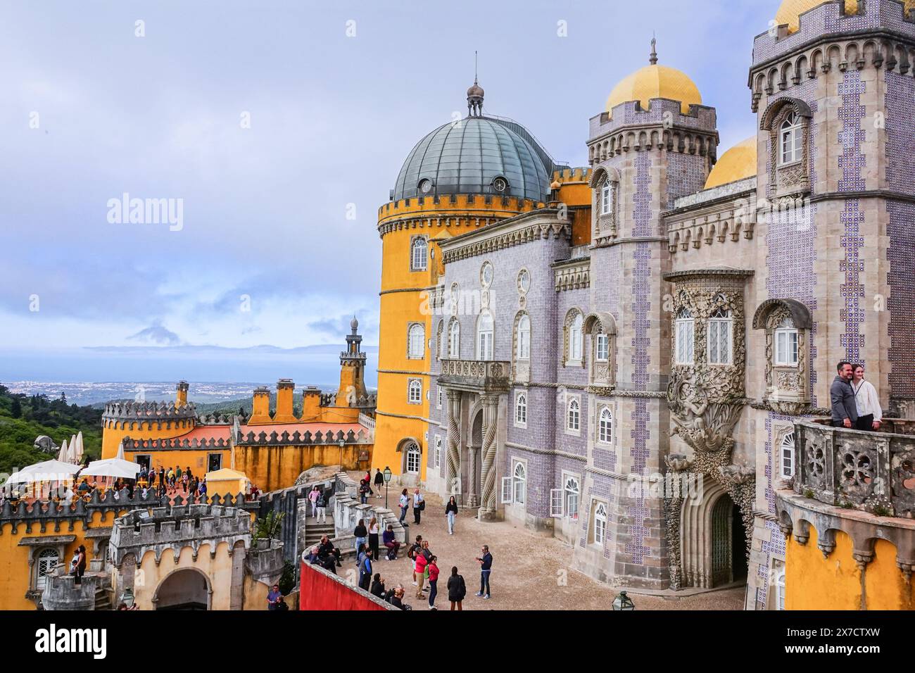 Eclectic styles of Pena Palace or Palácio da Pena historic palace castle viewed from the upper terrace in Sintra, Portugal. The fairytale castle palace is considered one of the finest examples of 19th century Portuguese Romanticism architecture in the world. Stock Photo