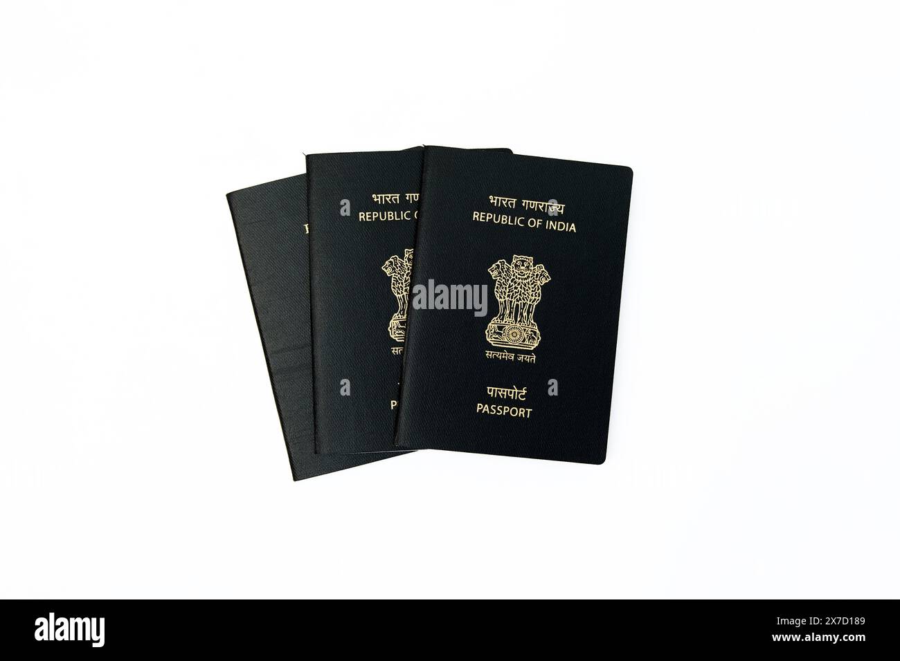This image is about Two Indian passports on a white background Isolated with clipping path Stock Photo