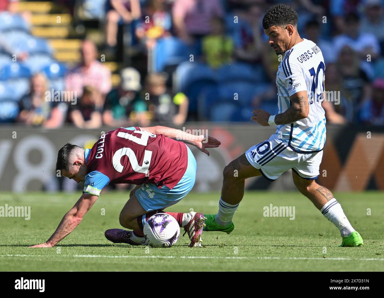 Turf Moor, Burnley, Lancashire, UK. 19th May, 2024. Premier League Football, Burnley versus Nottingham Forest; Josh Cullen of Burnley slips during a tussle with Morgan Gibbs-White of Nottingham Forest Credit: Action Plus Sports/Alamy Live News Stock Photo