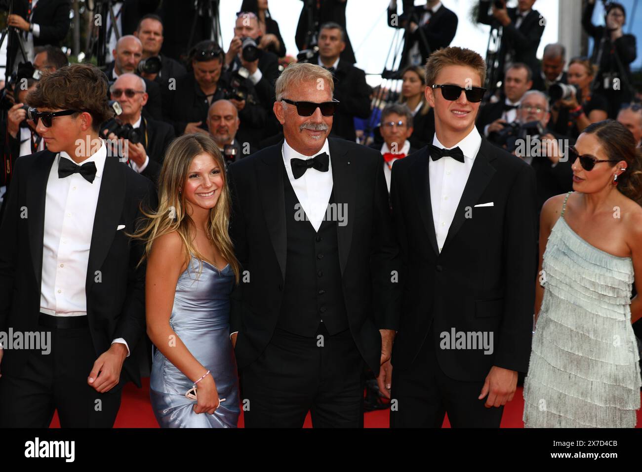 May 19, 2024, Cannes, Cote D'azur, France: Lily Costner, Hayes Logan Costner, Grace Avery Costner, Kevin Costner, Cayden Wyatt Costner and Annie Costner walk the red carpet ahead of the 'Horizon: an American Saga' Premiere screening at the 77th Annual Cannes Film Festival at Palais des Festivals in Cannes, France (Credit Image: © Mickael Chavet/ZUMA Press Wire) EDITORIAL USAGE ONLY! Not for Commercial USAGE! Stock Photo