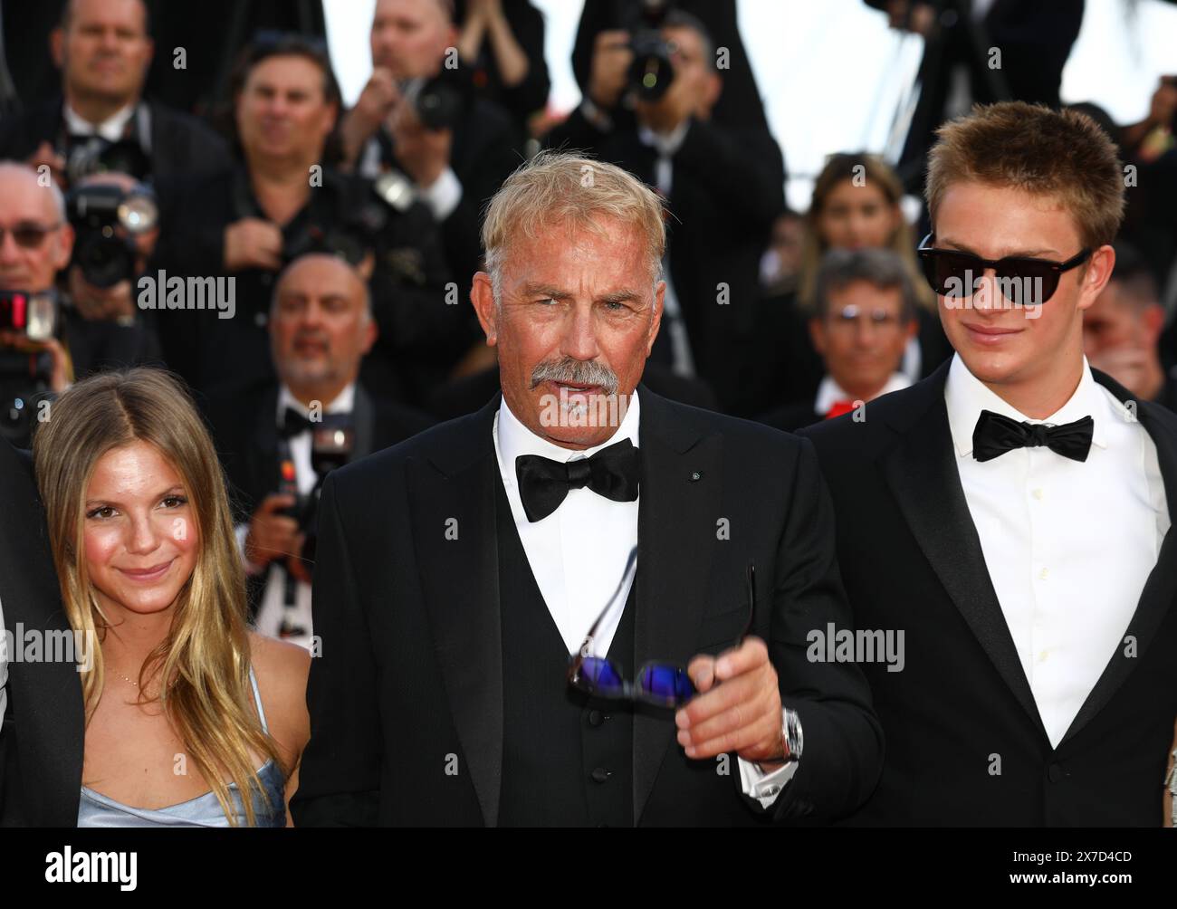 May 19, 2024, Cannes, Cote D'azur, France: LILY COSTNER, KEVIN COSTNER and HAYES LOGAN COSTNER walk the red carpet ahead of the 'Horizon: an American Saga' Premiere screening at the 77th Annual Cannes Film Festival at Palais des Festivals in Cannes, France (Credit Image: © Mickael Chavet/ZUMA Press Wire) EDITORIAL USAGE ONLY! Not for Commercial USAGE! Stock Photo