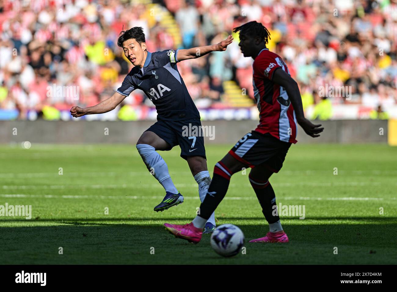 Bramall Lane, Sheffield, UK. 19th May, 2024. Premier League Football, Sheffield United versus Tottenham Hotspur; Son Heung-min of Spurs plays a pass through the legs of Andre Brooks of Sheffield Credit: Action Plus Sports/Alamy Live News Stock Photo
