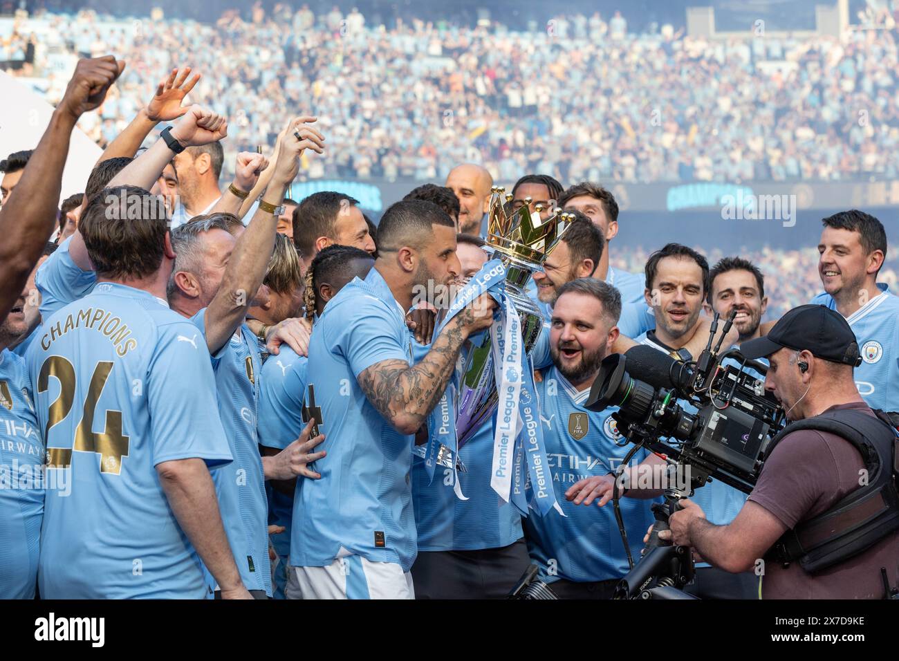 Kyle Walker of Manchester City kisses the Premier League Trophy during