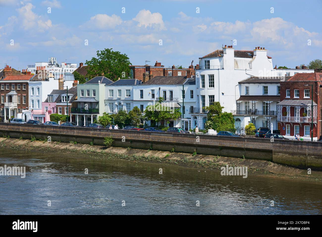Historic Georgian houses along the waterfront at Barnes, West London UK, viewed from Barnes Bridge Stock Photo