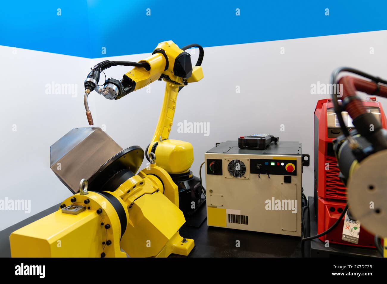 Welding robot arms on a smart factory. Stock Photo