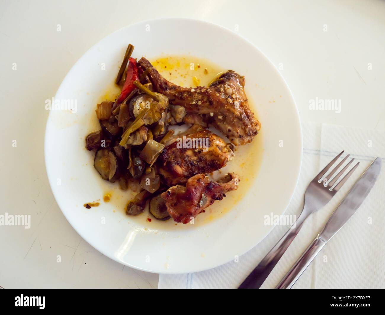 Roasted rabbit served with potato and vegetables Stock Photo