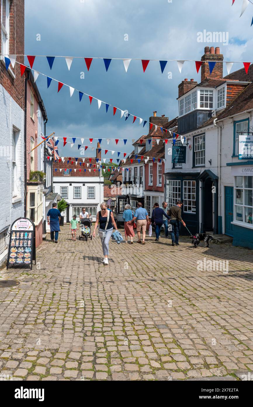 People walking along Quay Hill in Lymington town centre, Hampshire, England, UK Stock Photo