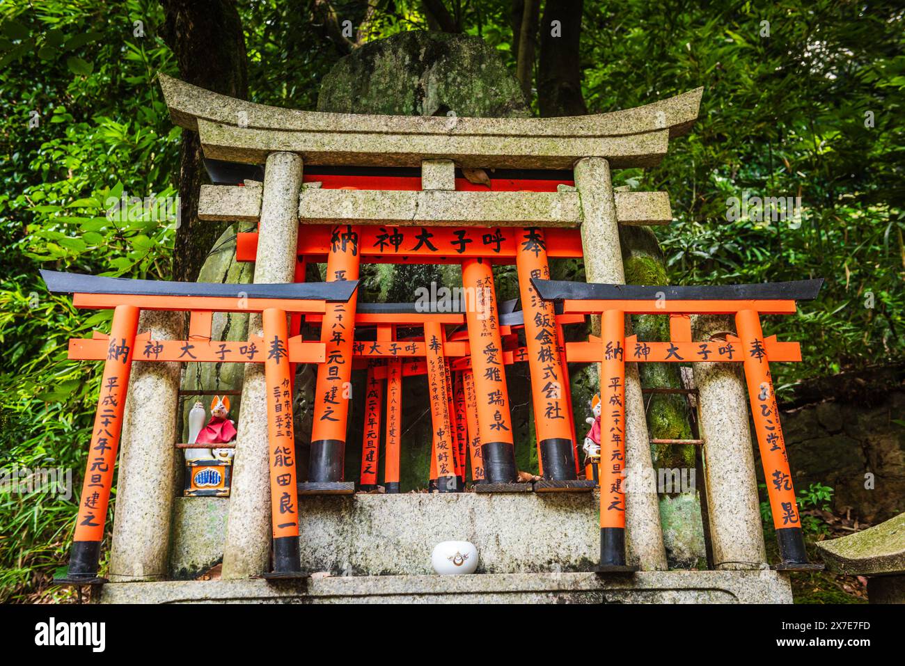Kyoto, JAPAN - July 29, 2016: Kitsune and Torii Gates at top of Mount Inari. Stock Photo