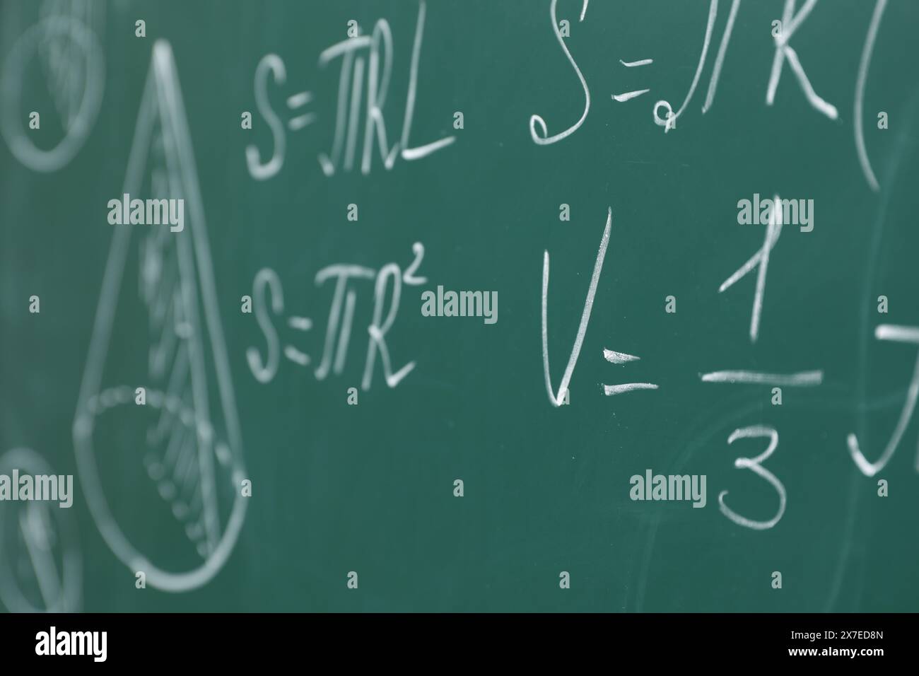 Different math formulas written with chalk on green board Stock Photo ...