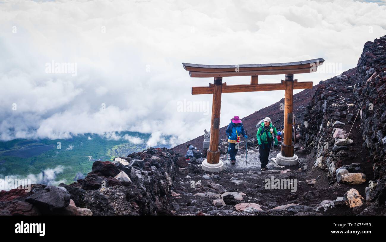 Mt. Fuji,, JAPAN - August 1, 2016: Climbers pass through Torii Gate at Mt Fuji summit. Stock Photo