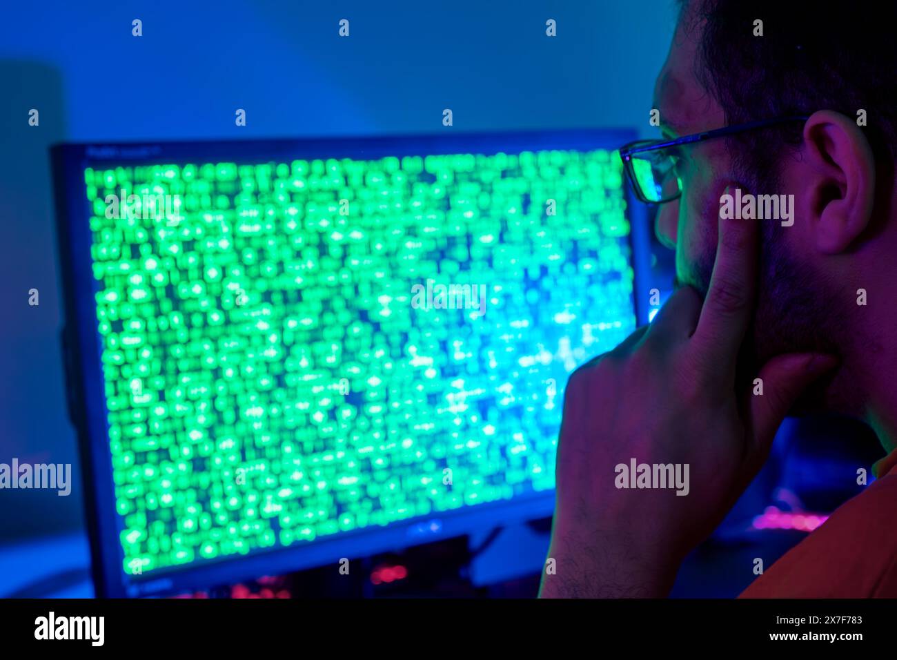 An AI data worker analyzing data on a screen, focused on machine ...