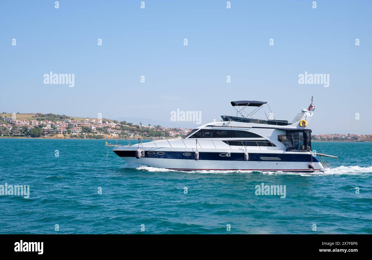 Side view of a motorboat sailing on the sea in Ayvalık, Turkey Stock ...