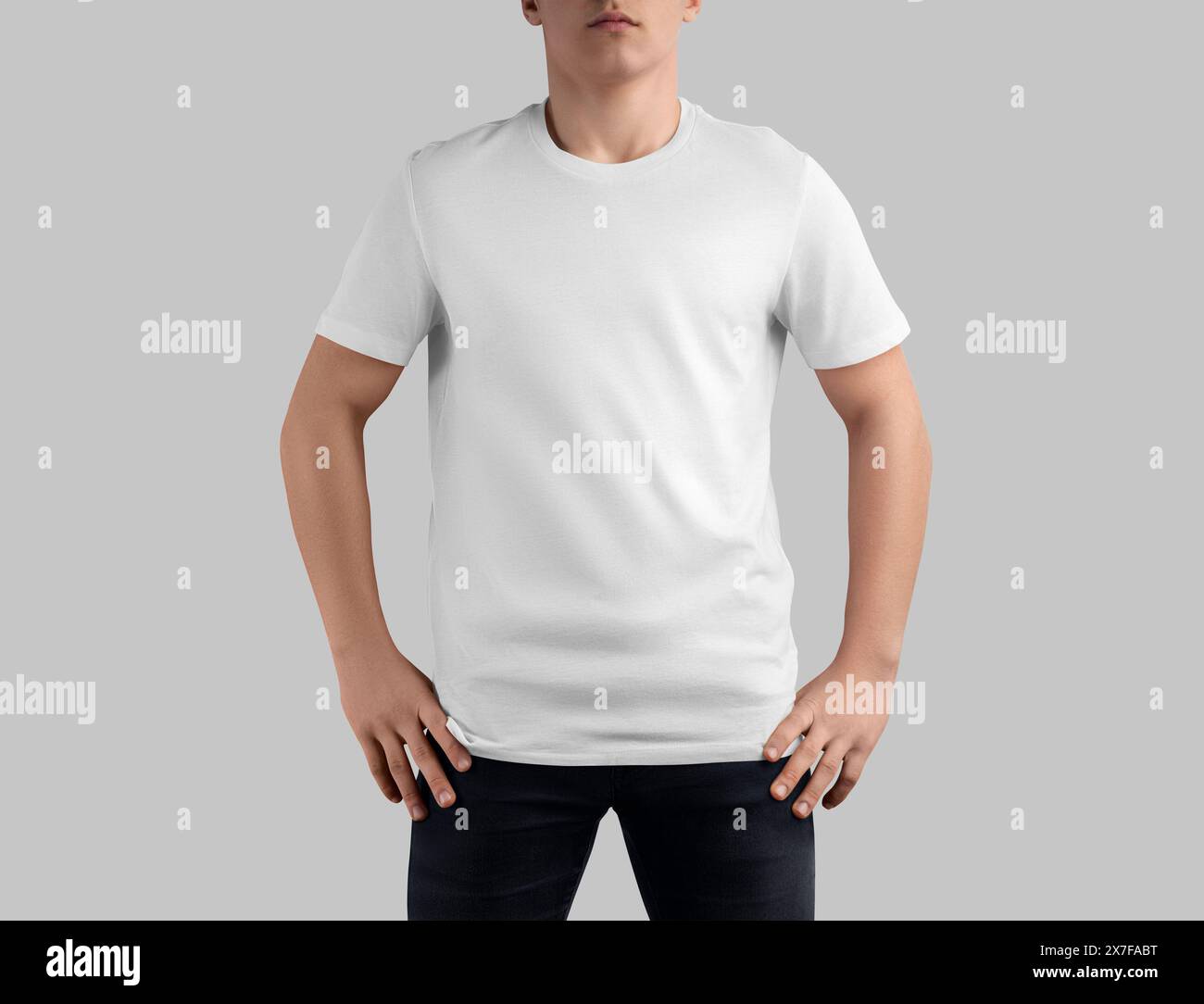 White t-shirt mockup on guy in black jeans, crew neck shirt for design, print, branding, front view. Template of fashionable casual clothes, men's app Stock Photo