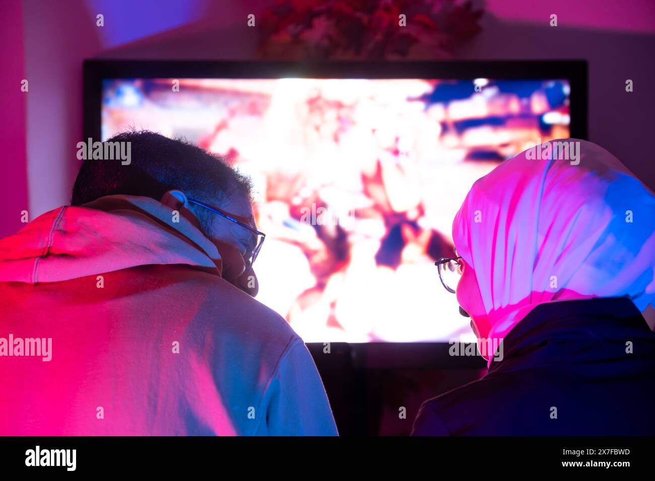 Couple or friends have shocking, exciting face with fun, using joystick ...