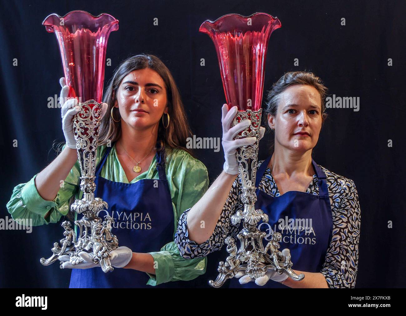 Olympia Auctions London 20 May 2024 A Pair of Victorian electroplate vase stands with cranberry glass liners, probably Pryor Tyzack and Co, Sheffield, C 1860 Est £ 300-500. Auction Date 23-May 2024.25 Blythe Road. Credit: Paul Quezada-Neiman/Alamy Live News Stock Photo