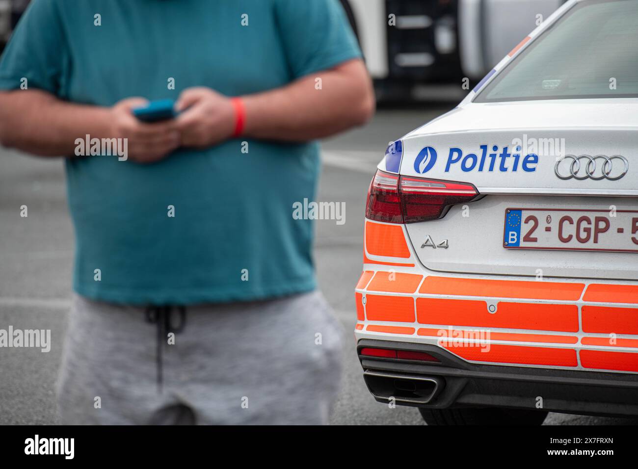 Antwerp, Belgium. 20th May, 2024. A truck driver is seen using his mobile phone as the Antwerp Police Zone, the Federal Police, the Social Intelligence and Investigation Service SIOD and the European Labor Authority ELA are organizing a large-scale heavy transport inspection action under the leadership of the labor auditor, with a focus on the employment conditions of truck drivers, in Antwerp, Monday 20 May 2024. BELGA PHOTO JONAS ROOSENS Credit: Belga News Agency/Alamy Live News Stock Photo