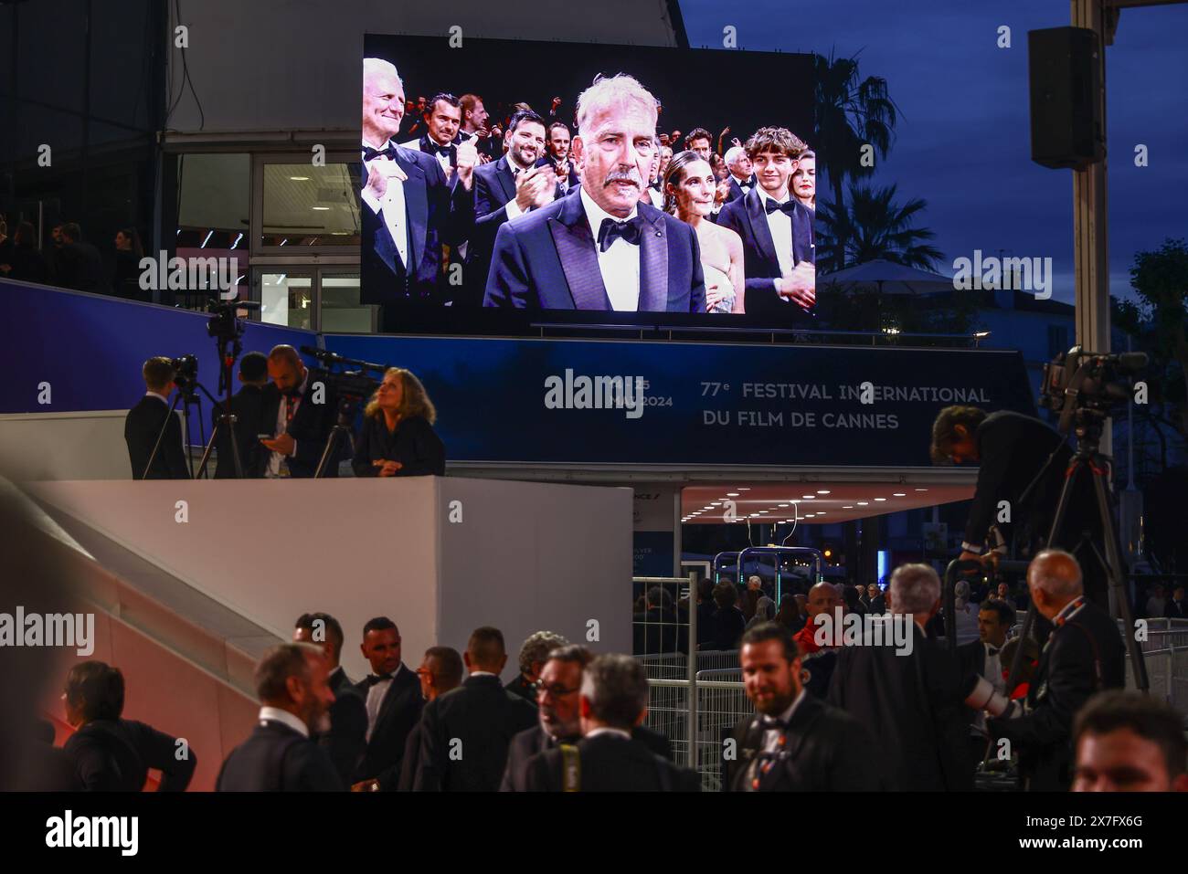 Cannes, France. 19th May, 2024. An outdoor screen is showing Kevin