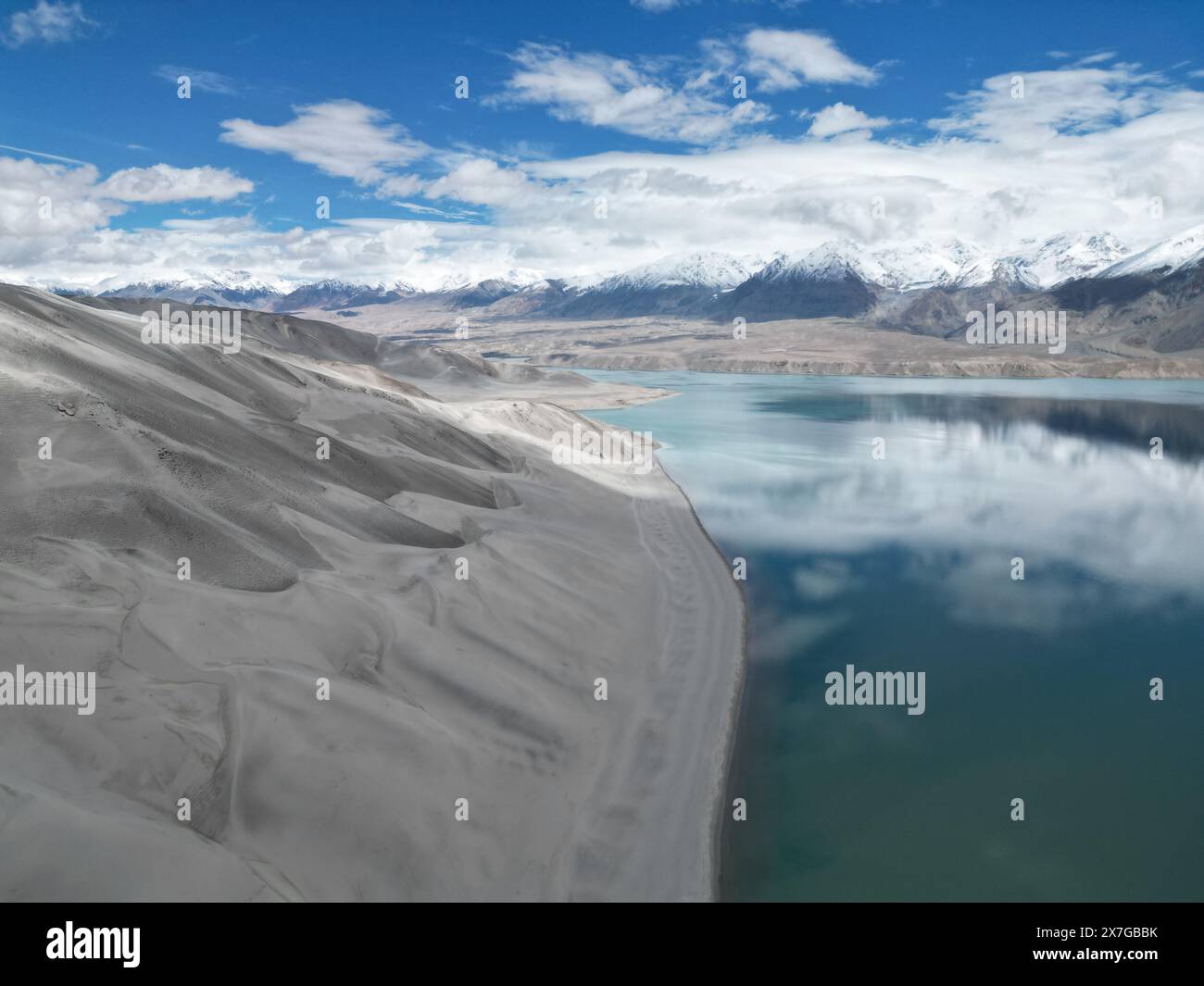Urumqi. 19th May, 2024. An aerial drone photo taken on May 19, 2024 shows a view of the Baisha Lake scenic area in Akto County, northwest China's Xinjiang Uygur Autonomous Region. May 19 marks the China Tourism Day. Credit: Yin Xingyu/Xinhua/Alamy Live News Stock Photo