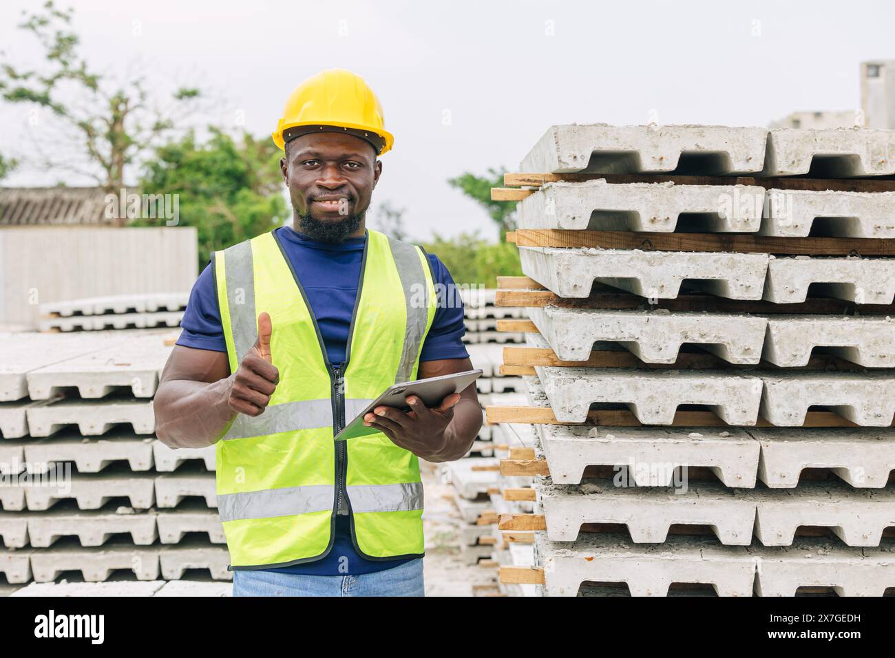 Engineer worker standing Thumbs up with precast concrete casting finished production for confirm standard passed approved check. Stock Photo
