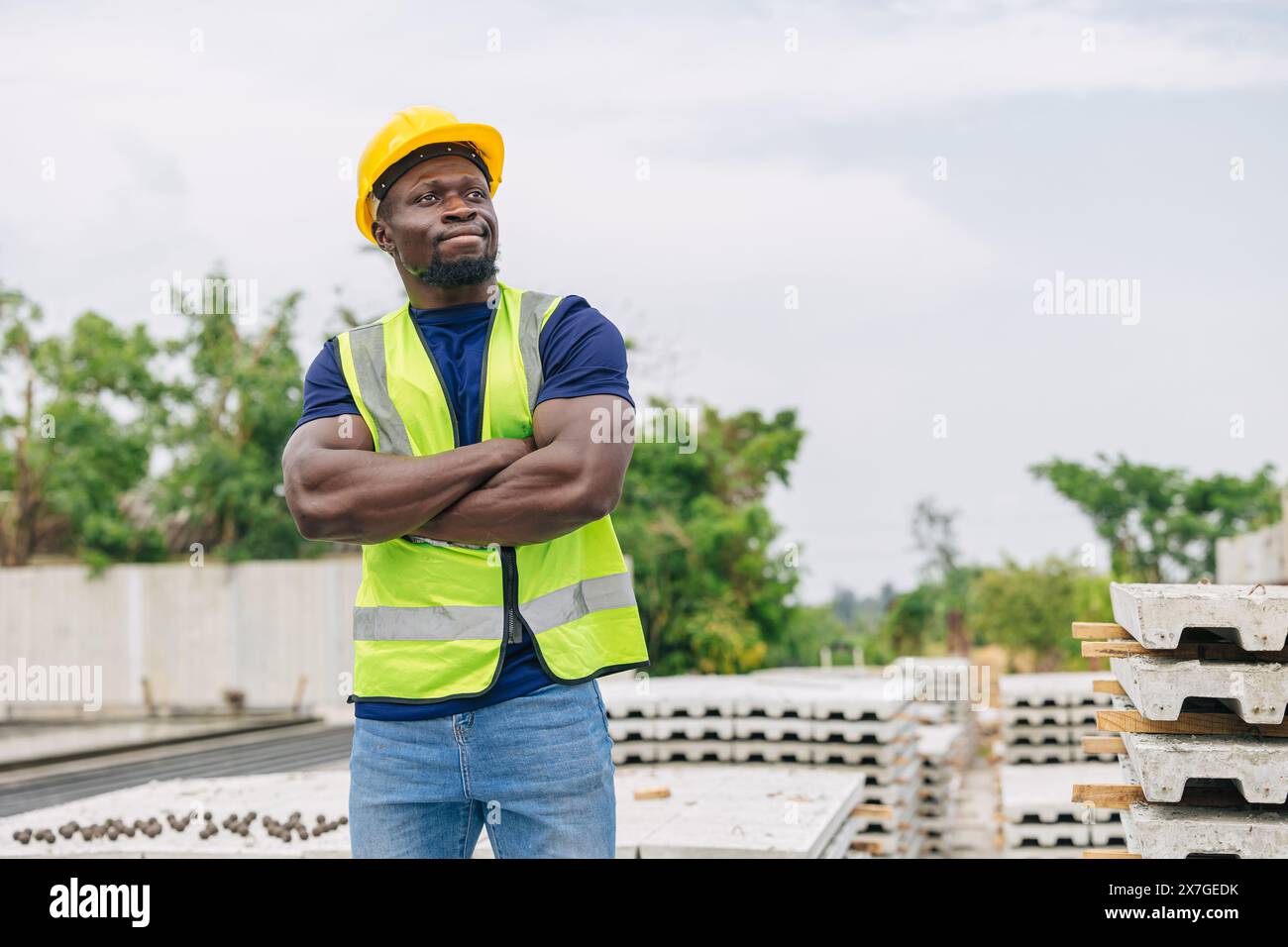 Portrait confident African black smart engineer arm cross worker foreman supervisor working outdoor in Precast concrete casting industry Stock Photo