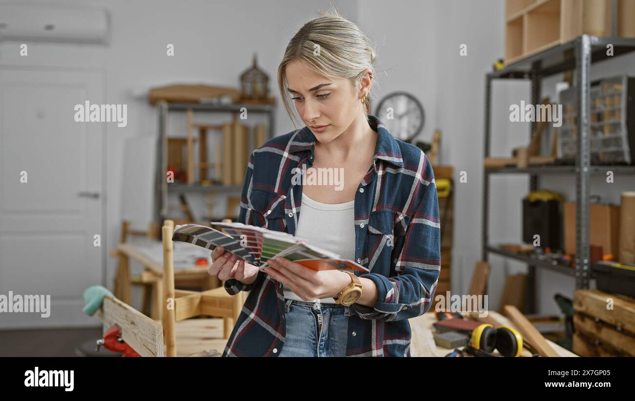 Workshop Color Sample Woman examines design samples in hi-res stock photography and images ...