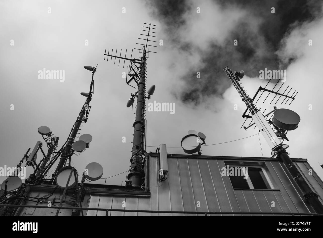 Radio tower, antennas, sky, clouds, satellite station ...