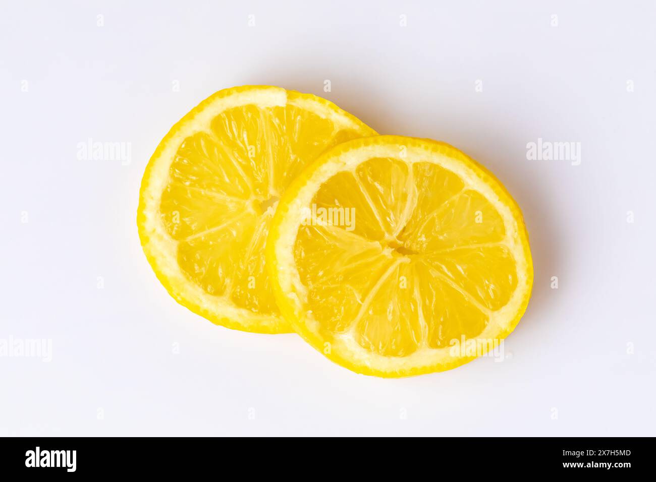 Two lemon slices on a white background Stock Photo