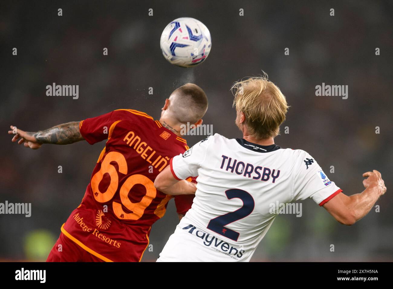 Jose Angel Esmoris Tasende Angelino of AS Roma and Morten Thorsby of Genoa CFC compete for the ball during the Serie A football match between AS Roma and Genoa CFC at Olimpico stadium in Rome (Italy), May 19th, 2024. Stock Photo