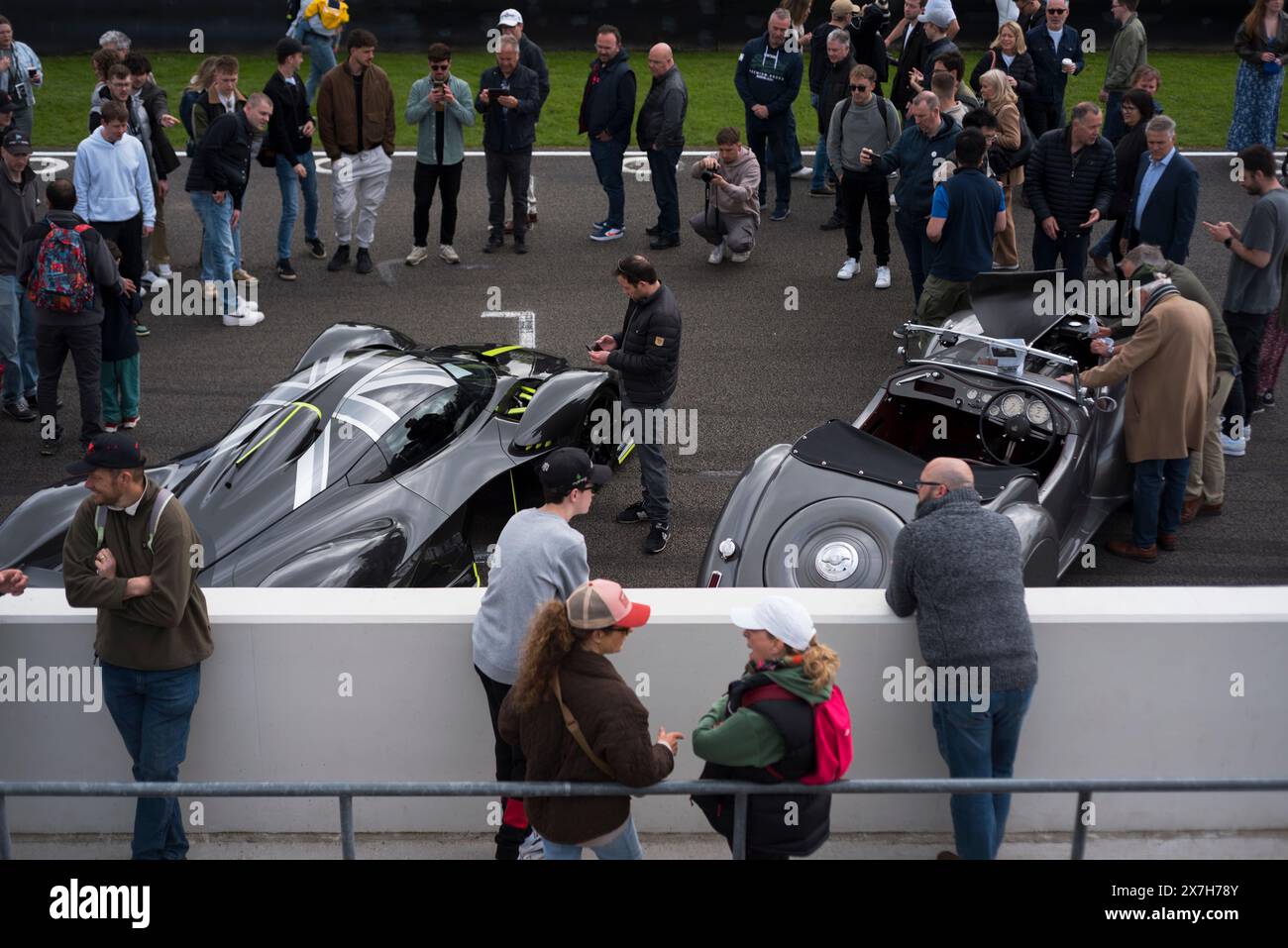 People crowding round an Aston Martin Valkyrie Hypercar at the 100th Breakfast Club at Goodwood motor racing circuit, Chichester,West Sussex,UK Stock Photo
