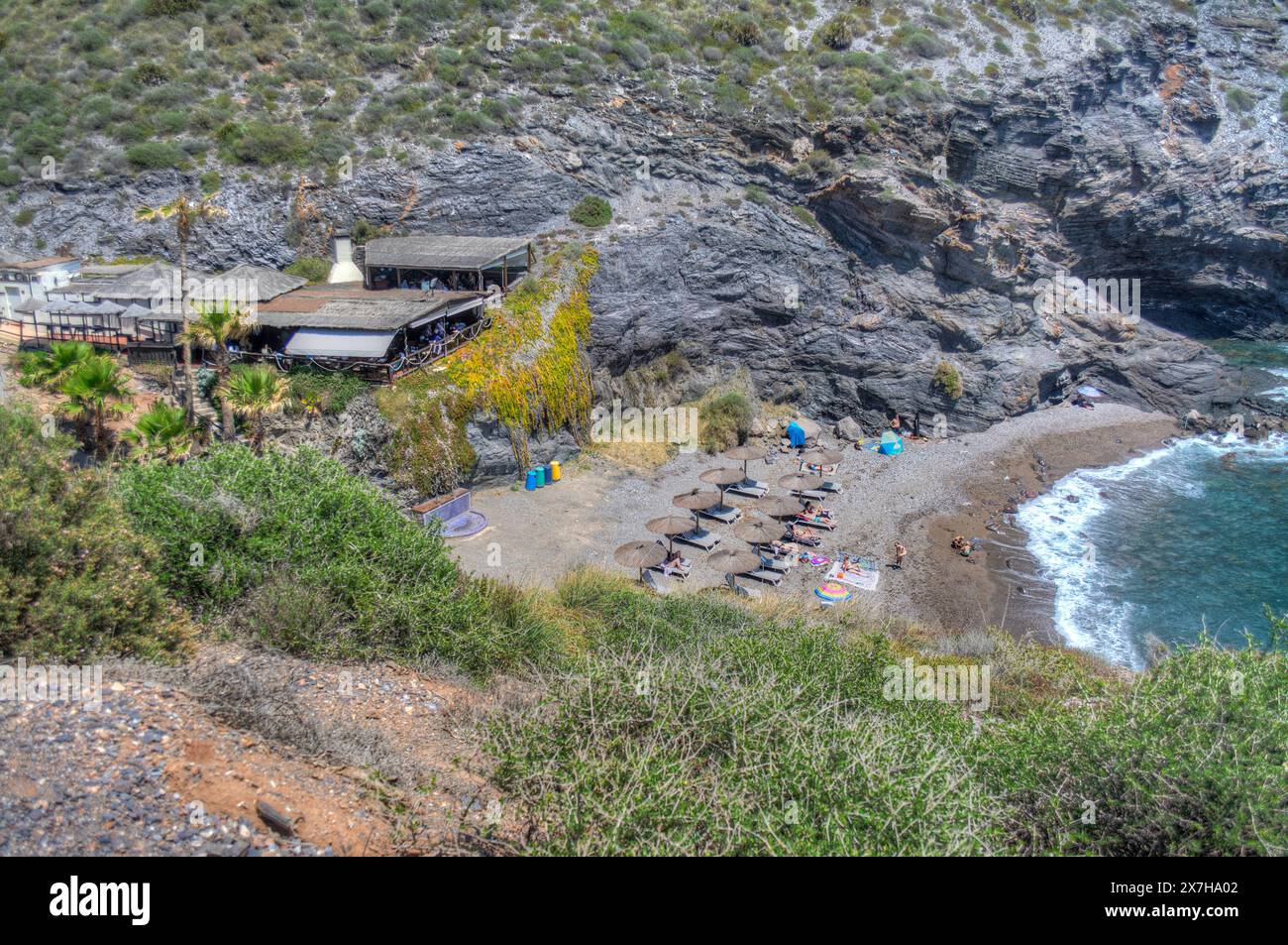 HDR image of the Beach and La Cala restaurant at Cala del Barco in La Manga Golf Resort Murcia Spain Stock Photo