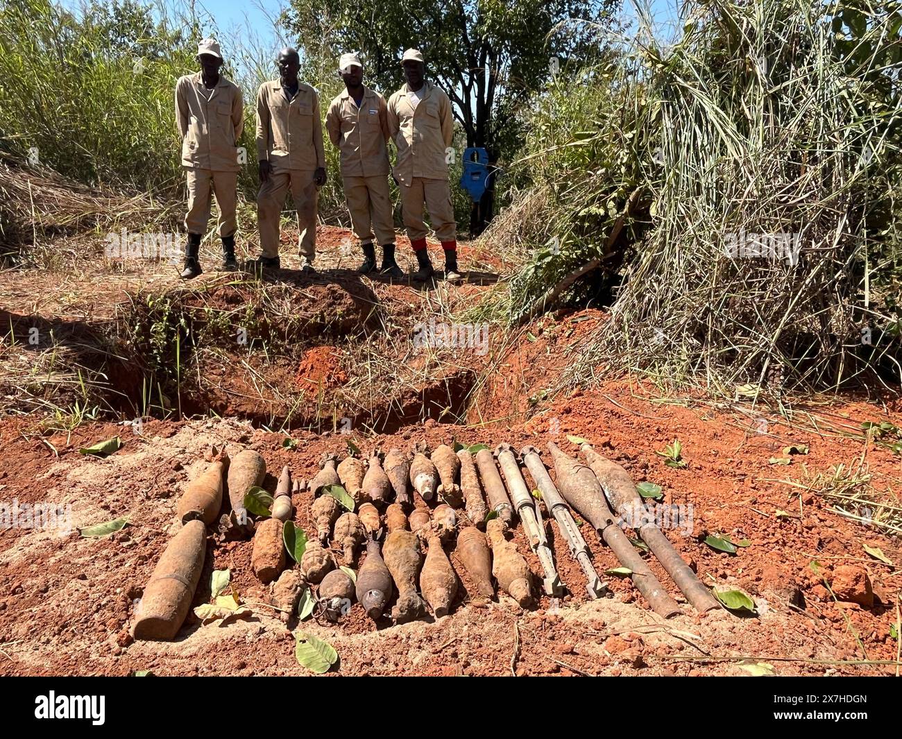Calulo, Angola. 03rd May, 2024. Employees of the Belgian organization Apopo stand behind grenades and explosive devices that were cleared with the help of giant hamster rats. They are called 'hero rats'. Credit: Kristin Palitza/dpa/Alamy Live News Stock Photo
