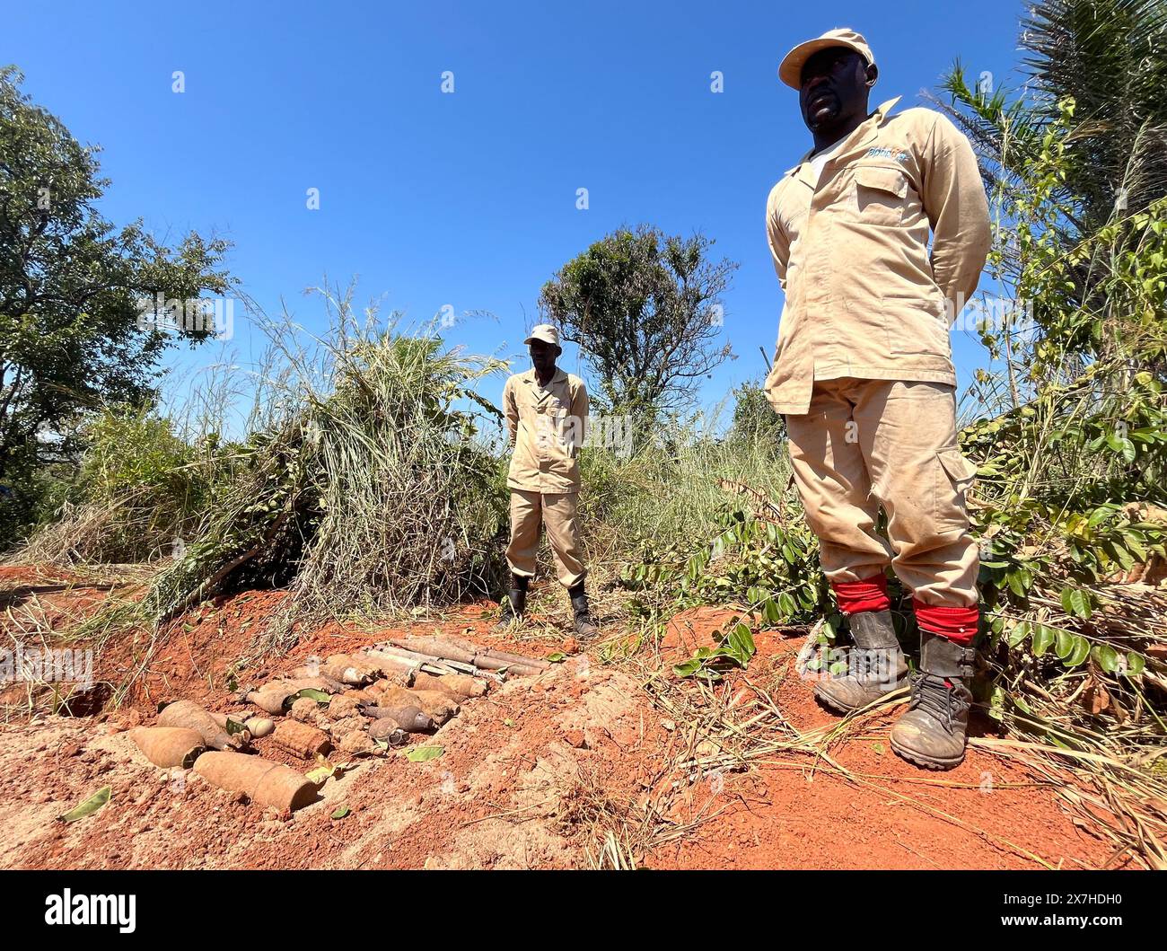 Calulo, Angola. 03rd May, 2024. Employees of the Belgian organization Apopo stand in front of grenades and explosive devices that were cleared with the help of giant hamster rats. They are called 'hero rats'. Credit: Kristin Palitza/dpa/Alamy Live News Stock Photo