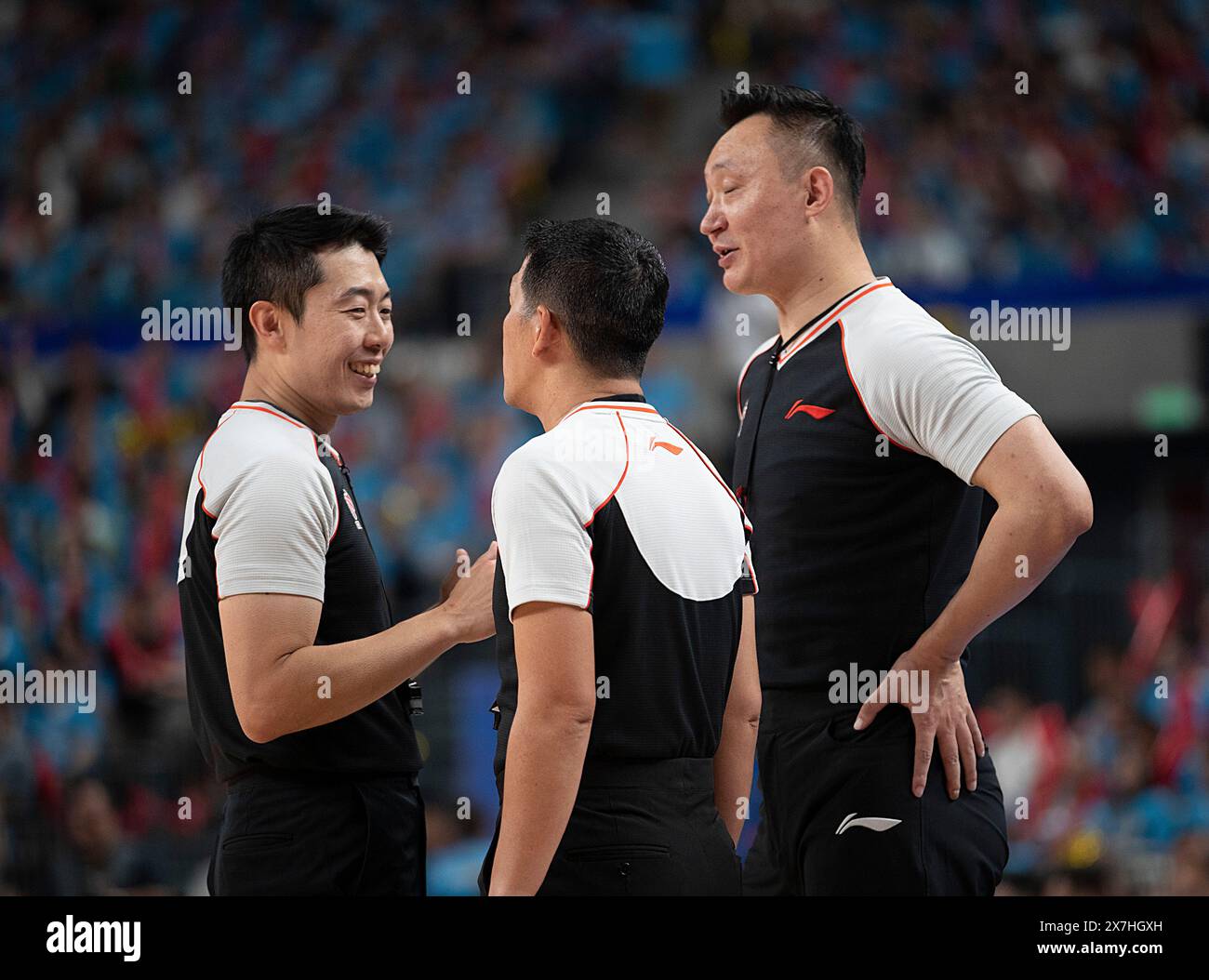 Urumqi, China's Xinjiang Uygur Autonomous Region. 20th May, 2024. Crew chief Harja Jaladri (C) of Indonesia talks with Umpire 2 Lee Kyounghwan (L) of South Korea and Umpire 1 Yan Jun of China during the play-off final third leg match between Xinjiang Flying Tigers and Liaoning Flying Leopards at the 2023-2024 season of the Chinese Basketball Association (CBA) league in Urumqi, northwest China's Xinjiang Uygur Autonomous Region, May 20, 2024. Credit: Luo Yuan/Xinhua/Alamy Live News Stock Photo
