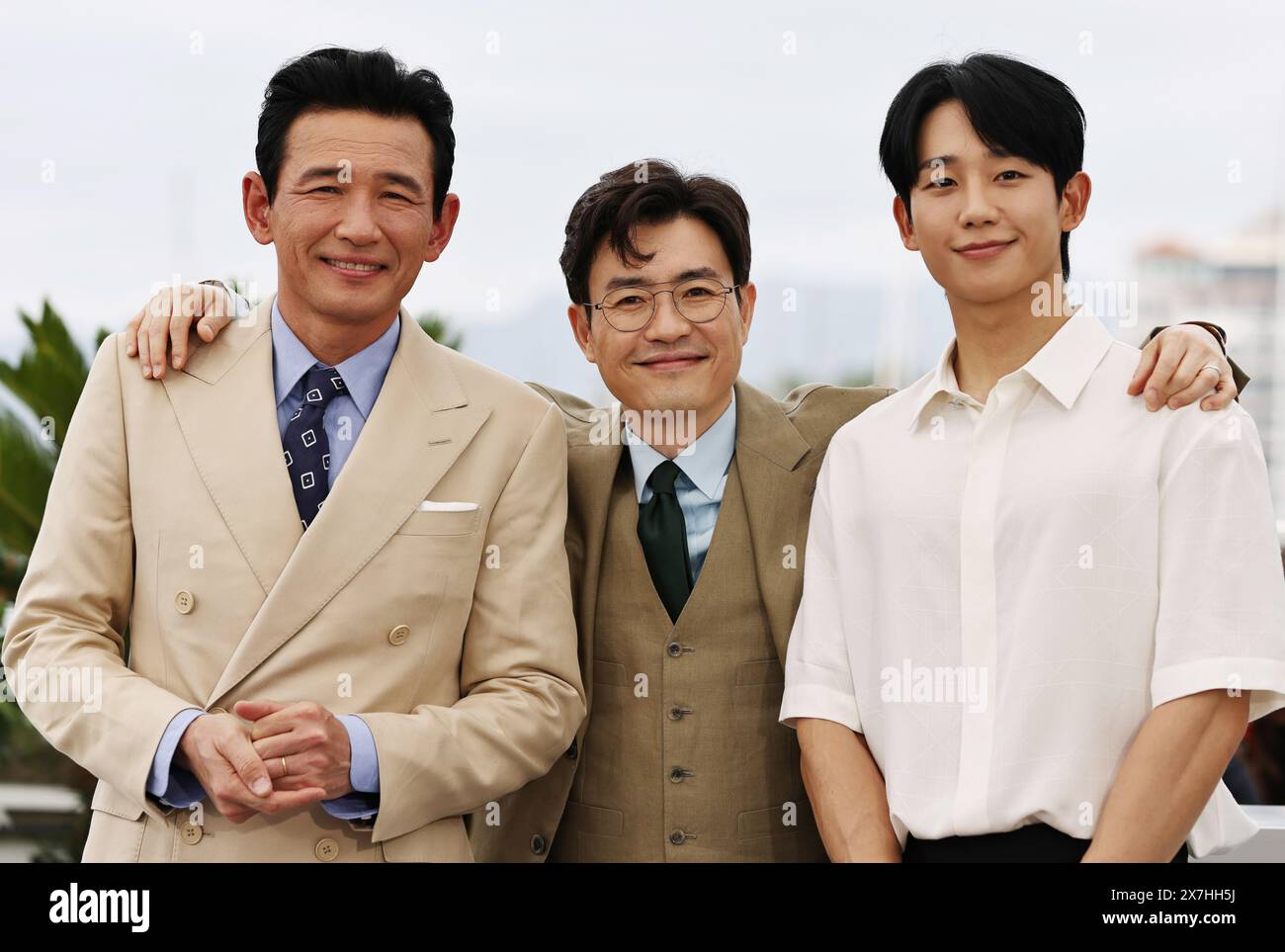 Cannes, France. 20th May, 2024. Actor Hwang Jung-Min (L), director Ryoo Seung-Wan (C) and actor Jung Hae-In pose during a photocall for the film 'Veteran 2' at the 77th Cannes Film Festival in Cannes, southern France, May 20, 2024. Credit: Gao Jing/Xinhua/Alamy Live News Stock Photo