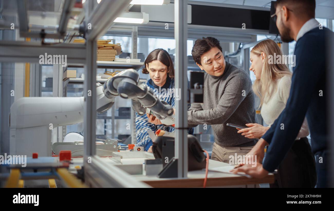 Young Specialists Examine Details of Robotic Hand and Smile During ...