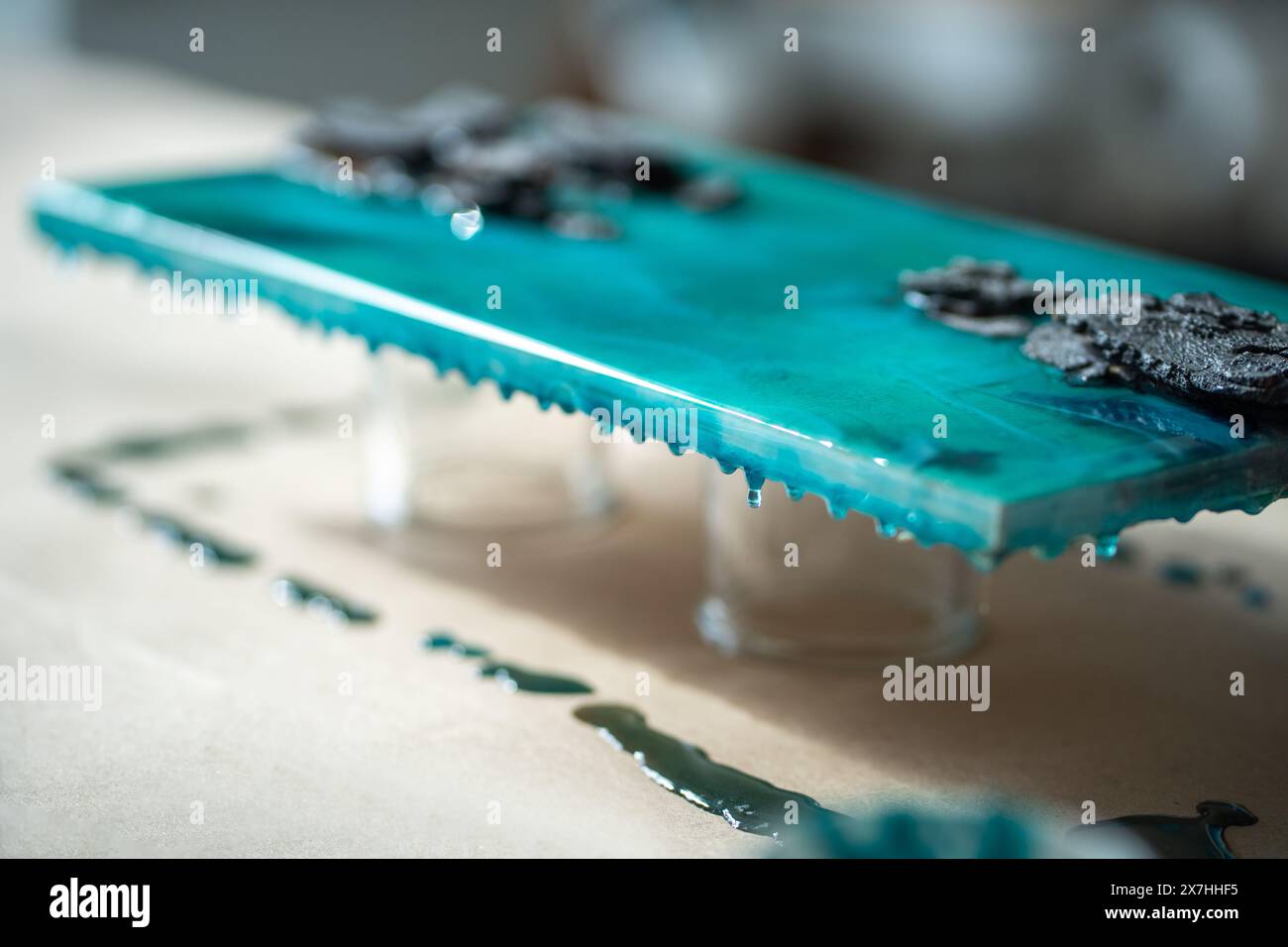 Finished painting dries after being poured with epoxy resin closeup