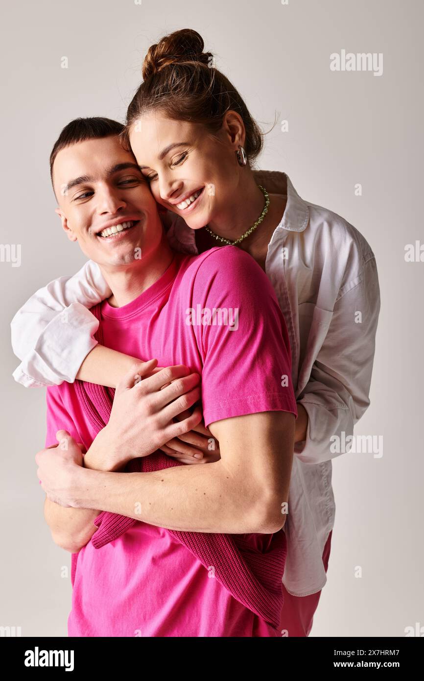 A stylish young couple in love passionately hugging each other in a ...