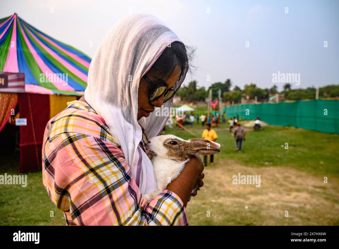a-young-village-girl-and-her-brother-visit-the-fair-with-their-pet