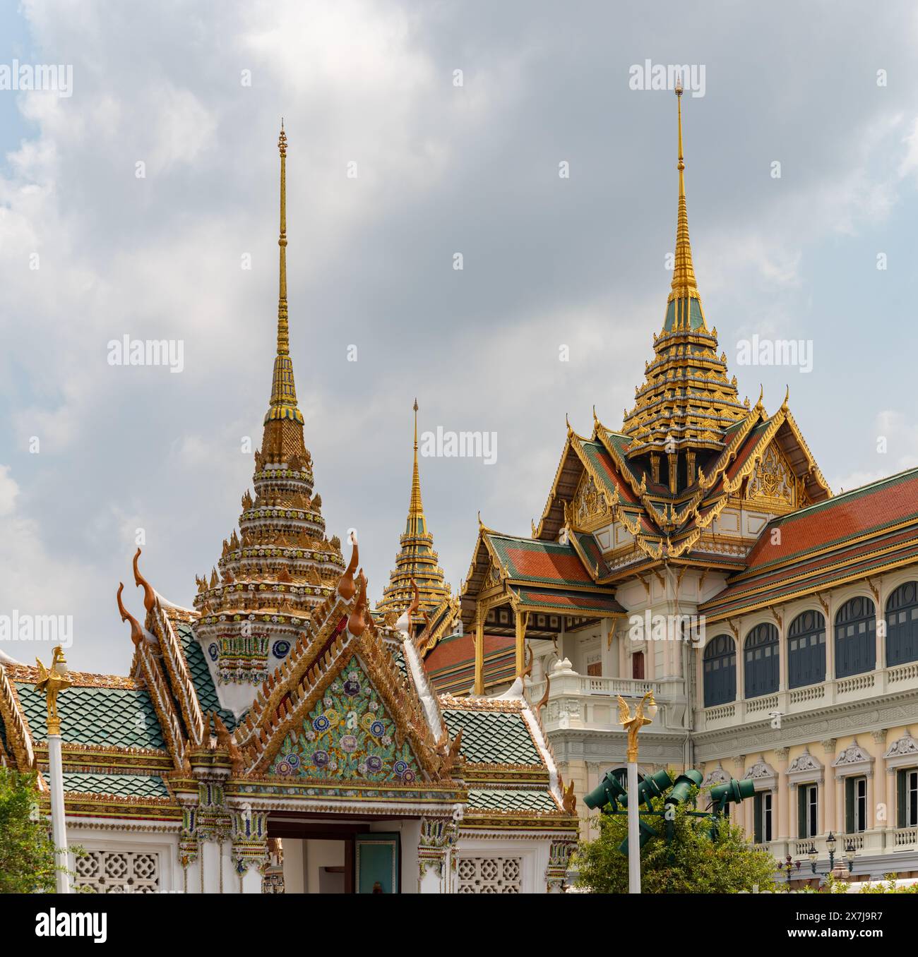 A picture of the Royal Hall of Dusit Maha Prasat and the Chakri Maha Prasat Throne Hall at the Grand Palace. Stock Photo