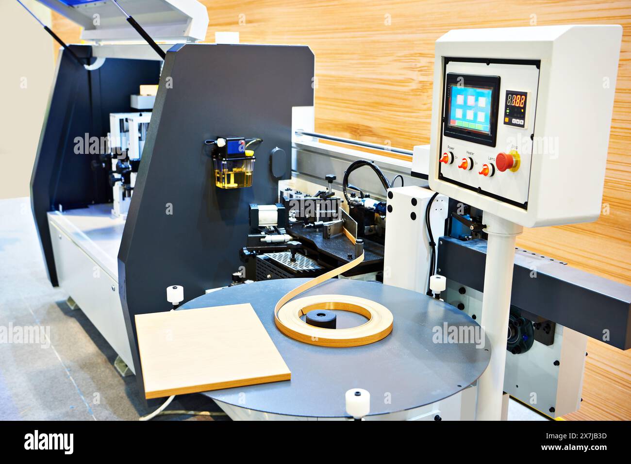 Single sided automatic edge banders on factory Stock Photo