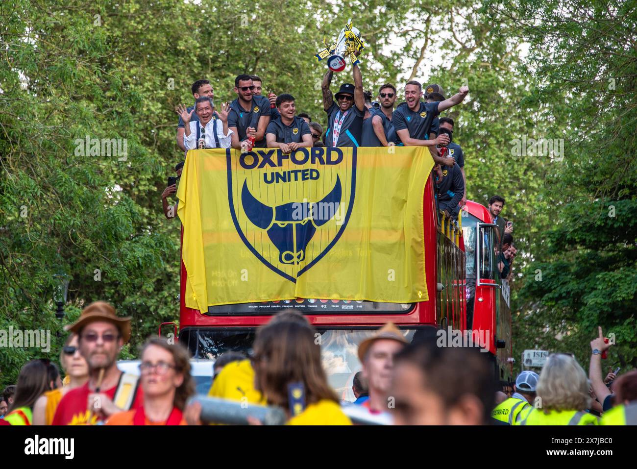 Oxford, May 20th 2024. Oxford United pass Magdalen Tower on an open top bus through the city's streets to celebrate their 2–0 win over Bolton Wanderers in the play-off final and promotion to the Championship again after 25 years. Credit: Martin Anderson/Alamy Live News Stock Photo